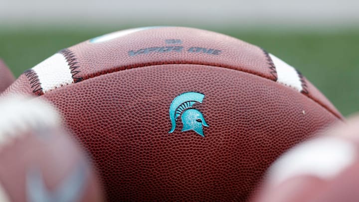 Oct 12, 2019; Madison, WI, USA; Michigan State Spartans logo on footballs during warmups prior to the game against the Wisconsin Badgers at Camp Randall Stadium. Mandatory Credit: Jeff Hanisch-Imagn Images