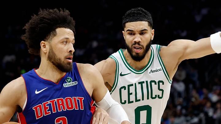 Feb 26, 2025; Detroit, Michigan, USA;  Detroit Pistons guard Cade Cunningham (2) dribbles on Boston Celtics forward Jayson Tatum (0) in the second half at Little Caesars Arena. Mandatory Credit: Rick Osentoski-Imagn Images