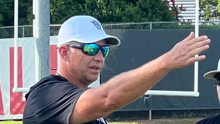 N.C. State football coach Dave Doeren, left, on July 30, 2025, the Wolfpack's first day of preseason practice ahead of the 2025 season.