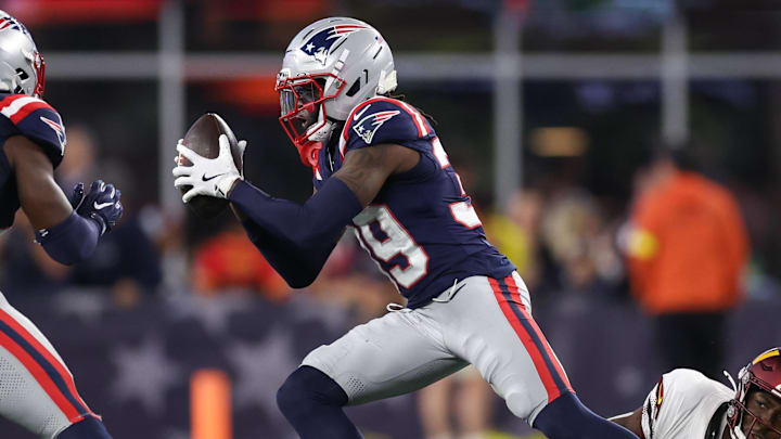 Aug 8, 2025; Foxborough, Massachusetts, USA; New England Patriots cornerback Jordan Polk (39) intercepts a pass during the second half against the Washington Commanders at Gillette Stadium. Mandatory Credit: Paul Rutherford-Imagn Images