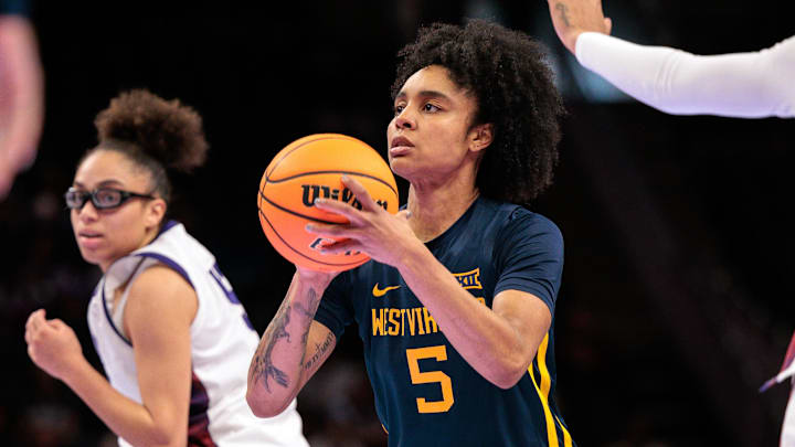 Mar 8, 2026; Kansas City, MO, USA; West Virginia Mountaineers guard Sydney Shaw (5) shoots the ball during the first half against the TCU Horned Frogs at T-Mobile Center. Mandatory Credit: William Purnell-Imagn Images Mar 8, 2026; Kansas City, MO, USA; West Virginia Mountaineers guard Sydney Shaw (5) shoots the ball during the first half against the TCU Horned Frogs at T-Mobile Center. Mandatory Credit: William Purnell-Imagn Images