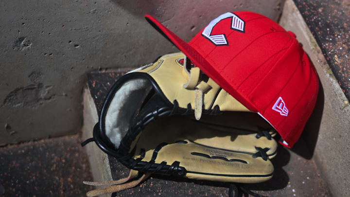 Apr 11, 2026; Cincinnati, Ohio, USA;  A view of an official Cincinnati Reds hat on the dugout steps during the game against the Los Angeles Angels at Great American Ball Park. Mandatory Credit: Aaron Doster-Imagn Images