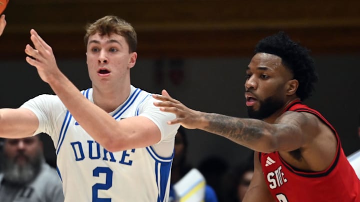 Jan 27, 2025; Durham, North Carolina, USA; Duke Blue Devils forward Cooper Flagg (2) throws a pass as North Carolina State Wolfpack guard Dontrez Styles (3) defends during the first half at Cameron Indoor Stadium. Mandatory Credit: Rob Kinnan-Imagn Images