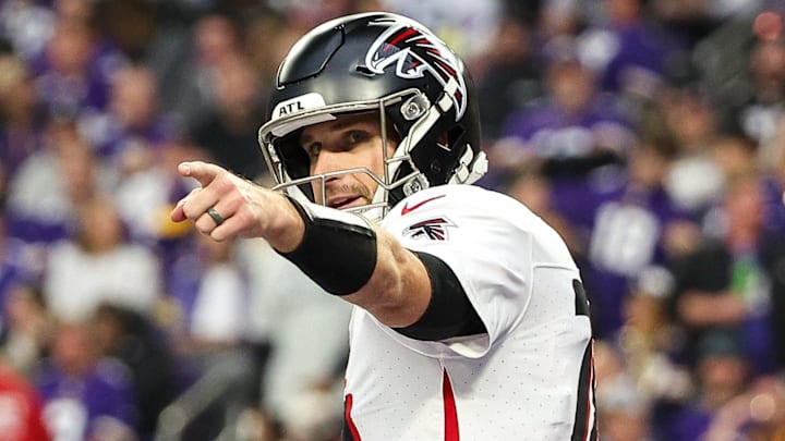 Dec 8, 2024; Minneapolis, Minnesota, USA; Atlanta Falcons quarterback Kirk Cousins (18) celebrates running back Bijan Robinson's (7) touchdown against the Minnesota Vikings during the third quarter at U.S. Bank Stadium. Mandatory Credit: Matt Krohn-Imagn Images