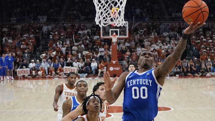 Feb 15, 2025; Austin, Texas, USA; Kentucky Wildcats guard Otega Oweh (0) lays in a basket ahead of Texas Longhorns guard Tre Johnson (20) during the first half at Moody Center. Mandatory Credit: Scott Wachter-Imagn Images