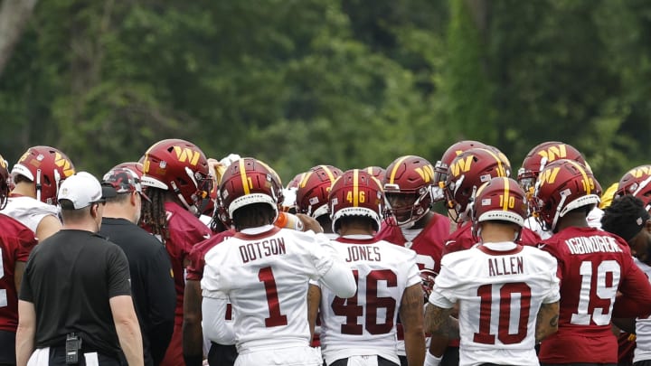 Jun 5, 2024; Ashburn, VA, USA; Washington Commanders players huddle during OTA workouts at Commanders Park. Mandatory Credit: Geoff Burke-USA TODAY Sports Jun 5, 2024; Ashburn, VA, USA; Washington Commanders players huddle during OTA workouts at Commanders Park. Mandatory Credit: Geoff Burke-USA TODAY Sports