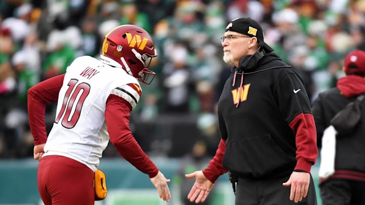 Jan 26, 2025; Philadelphia, PA, USA; Washington Commanders punter Tress Way (10) high fives head coach Dan Quinn during the first half in the NFC Championship game at Lincoln Financial Field. Mandatory Credit: Eric Hartline-Imagn Images
