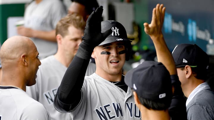 May 20, 2018; Kansas City, MO, USA; New York Yankees first baseman Tyler Austin (26) is congratulated in the dugout after scoring in the fifth inning against the Kansas City Royals at Kauffman Stadium. Mandatory Credit: Denny Medley-Imagn Images