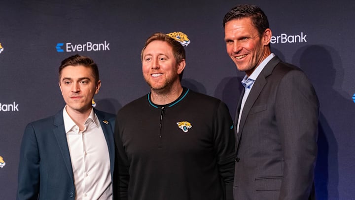 Jacksonville Jaguars new General Manager James Gladstone, left, poses for pictures with Head Coach Liam Coen, center and Executive Vice President of Football Operations Tony Boselli, right, during a press conference Monday morning February 24, 2025 at the Miller Electric Center in Jacksonville, Fla. [Doug Engle/Florida Times-Union]2025