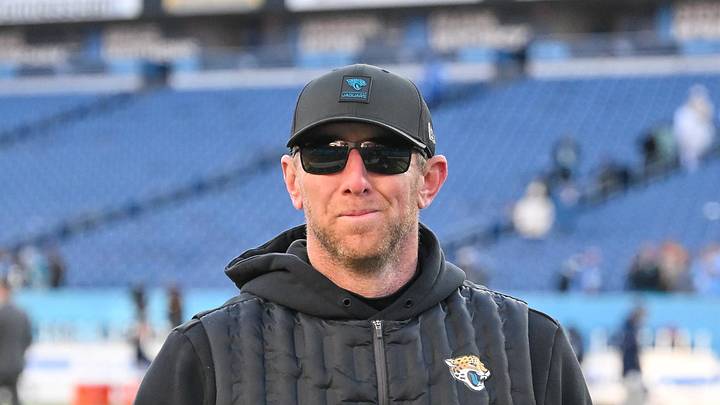 Nov 30, 2025; Nashville, Tennessee, USA;  Jacksonville Jaguars head coach Liam Coen smiles to the crowd as he walks of the field against the Tennessee Titans during the second half at Nissan Stadium. Mandatory Credit: Steve Roberts-Imagn Images