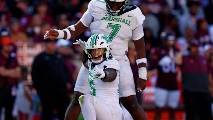 Marshall Thundering Herd defensive lineman Mike Green (15) celebrates after sacking Virginia Tech Hokies quarterback 