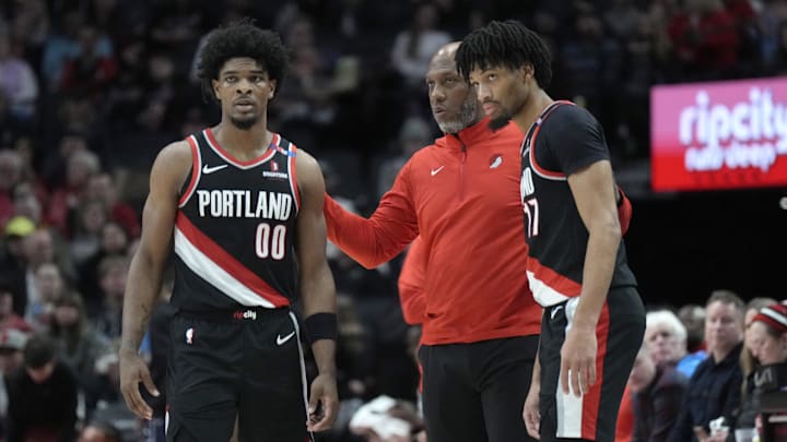 Jan 14, 2025; Portland, Oregon, USA; Portland Trail Blazers head coach Chauncey Billups talks to Scoot Henderson (00) and Shaedon Sharpe (17) during the first half against the Brooklyn Nets at Moda Center. Mandatory Credit: Soobum Im-Imagn Images