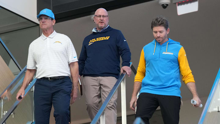 Jim Harbaugh and Joe Hortiz arrive for their press conference.