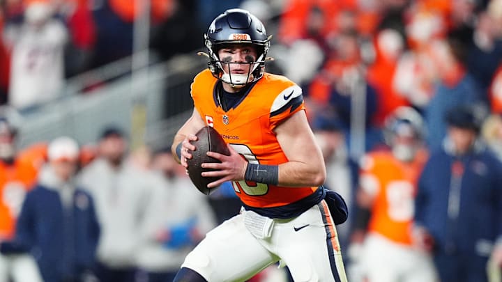 Dec 15, 2024; Denver, Colorado, USA; Denver Broncos quarterback Bo Nix (10) scrambles with the ball in the fourth quarter against the Indianapolis Colts at Empower Field at Mile High. 