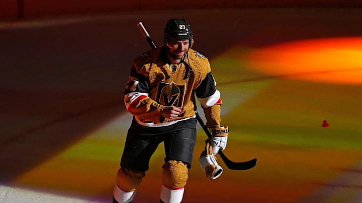 Jan 17, 2026; Las Vegas, Nevada, USA; Vegas Golden Knights defenseman Shea Theodore (27) is named First Star of the Game after the Golden Knights defeated the Nashville Predators 7-2 at T-Mobile Arena. Mandatory Credit: Stephen R. Sylvanie-Imagn Images