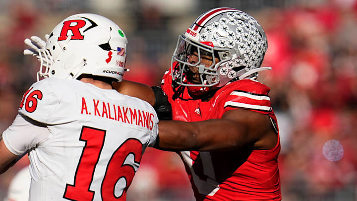 Ohio State Buckeyes linebacker Sonny Styles hits Rutgers Scarlet Knights quarterback Athan Kaliakmanis