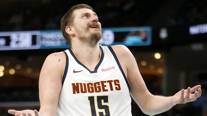 Mar 18, 2026; Memphis, Tennessee, USA; Denver Nuggets center Nikola Jokic (15) reacts during the second quarter against the Memphis Grizzlies at FedExForum. Mandatory Credit: Petre Thomas-Imagn Images Mar 18, 2026; Memphis, Tennessee, USA; Denver Nuggets center Nikola Jokic (15) reacts during the second quarter against the Memphis Grizzlies at FedExForum. Mandatory Credit: Petre Thomas-Imagn Images