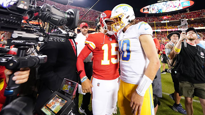 Sep 15, 2022; Kansas City, Missouri, USA; Los Angeles Chargers quarterback Justin Herbert (10) meets