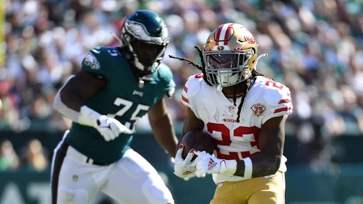 Sep 19, 2021; Philadelphia, Pennsylvania, USA; San Francisco 49ers running back JaMycal Hasty (23) runs past Philadelphia Eagles defensive end Tarron Jackson (75) during the fourth quarter at Lincoln Financial Field. Mandatory Credit: Eric Hartline-Imagn Images