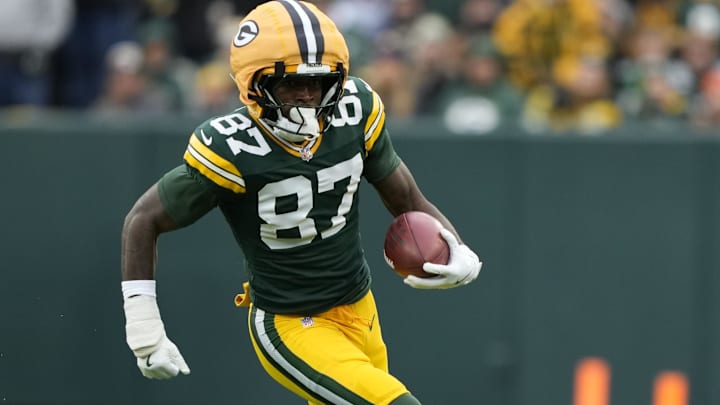 Nov 23, 2025; Green Bay, Wisconsin, USA; Green Bay Packers wide receiver Romeo Doubs (87) carries the ball against the Minnesota Vikings during the second half at Lambeau Field.