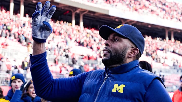 Michigan head coach Sherrone Moore uses hand signal 4-0 to celebrates the Wolverines 4th straight win over Ohio State at Ohio Stadium in Columbus, Ohio on Saturday, Nov. 30, 2024.
