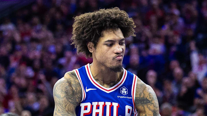 Apr 25, 2024; Philadelphia, Pennsylvania, USA; Philadelphia 76ers guard Kelly Oubre Jr. (9) reacts in front of New York Knicks guard Miles McBride (2) and guard Jalen Brunson (11) after scoring during the second half of game three of the first round for the 2024 NBA playoffs at Wells Fargo Center. Mandatory Credit: Bill Streicher-Imagn Images