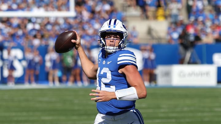Oct 12, 2024; Provo, Utah, USA; Brigham Young Cougars quarterback Jake Retzlaff (12) prepares to pass against the Arizona Wildcats during the first quarter at LaVell Edwards Stadium. Mandatory Credit: Rob Gray-Imagn Images