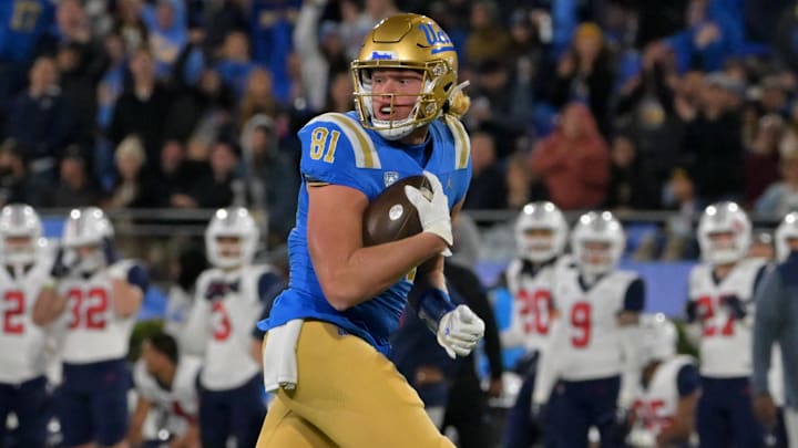 Nov 12, 2022; Pasadena, California, USA;   UCLA Bruins tight end Hudson Habermehl (81) completes a 51 yard pass play and runs into the end zone for a touchdown in the first half against the Arizona Wildcats at the Rose Bowl. Mandatory Credit: Jayne Kamin-Oncea-Imagn Images