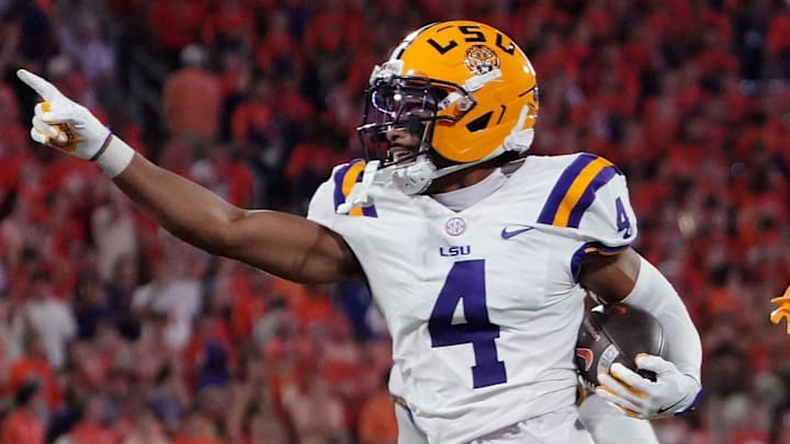 Aug 30, 2025; Clemson, South Carolina, USA; LSU Tigers cornerback Mansoor Delane (4) celebrates with safety Tamarcus Cooley (0) after a play against the Clemson Tigers during the second half at Memorial Stadium. Mandatory Credit: Ken Ruinard-USA TODAY Network via Imagn Images Aug 30, 2025; Clemson, South Carolina, USA; LSU Tigers cornerback Mansoor Delane (4) celebrates with safety Tamarcus Cooley (0) after a play against the Clemson Tigers during the second half at Memorial Stadium. Mandatory Credit: Ken Ruinard-USA TODAY Network via Imagn Images