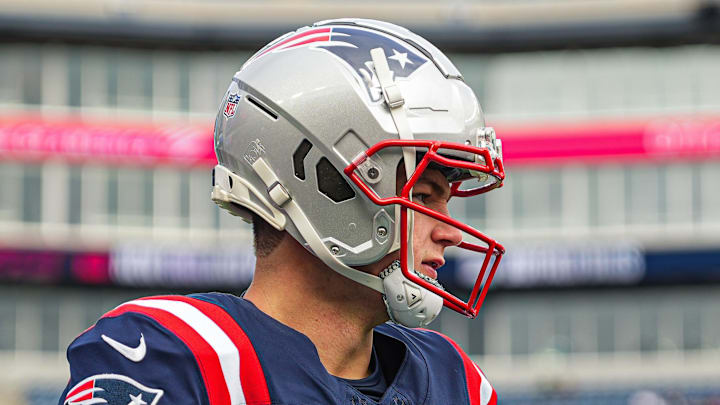 Jan 5, 2025; Foxborough, Massachusetts, USA; New England Patriots quarterback Drake Maye (10) and quarterback Jacoby Brissett (7) warm up before the start of the game against the Buffalo Bills at Gillette Stadium. Mandatory Credit: David Butler II-Imagn Images