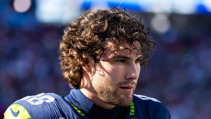 Seattle Seahawks tight end AJ Barner stands on the sidelines