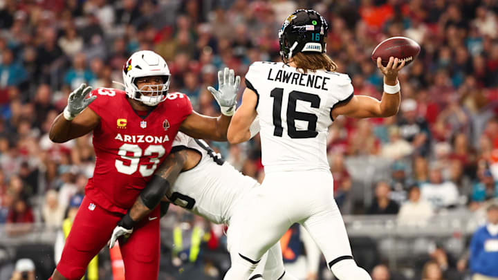 Nov 23, 2025; Glendale, Arizona, USA; Jacksonville Jaguars quarterback Trevor Lawrence (16) throws a pass as Arizona Cardinals defensive tackle Calais Campbell (93) defends during the first quarter at State Farm Stadium. Mandatory Credit: Mark J. Rebilas-Imagn Images Nov 23, 2025; Glendale, Arizona, USA; Jacksonville Jaguars quarterback Trevor Lawrence (16) throws a pass as Arizona Cardinals defensive tackle Calais Campbell (93) defends during the first quarter at State Farm Stadium. Mandatory Credit: Mark J. Rebilas-Imagn Images