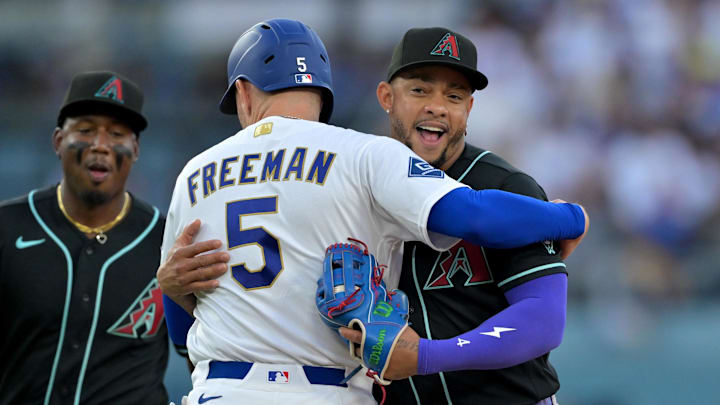 Diamondbacks second baseman Ketel Marte gets Dodgers first baseman Freddie Freeman out by hugging him. Diamondbacks second baseman Ketel Marte gets Dodgers first baseman Freddie Freeman out by hugging him.