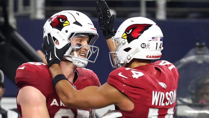 Nov 3, 2025; Arlington, Texas, USA;  Arizona Cardinals tight end Trey McBride (85) celebrates with wide receiver Michael Wilson (14) after scoring a touchdown against the Dallas Cowboys in the second half at AT&T Stadium. Mandatory Credit: Kevin Jairaj-Imagn Images