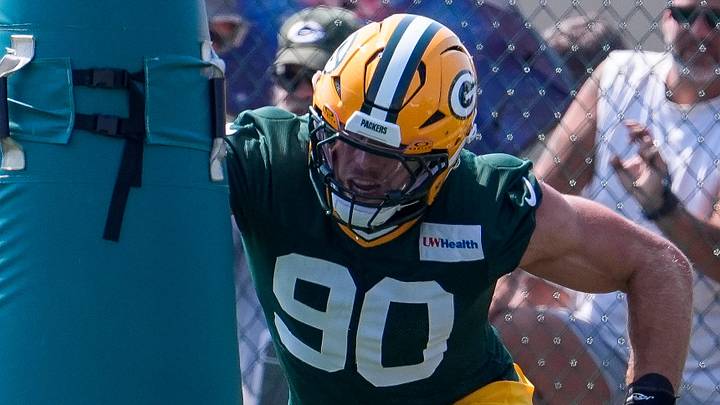 Green Bay Packers defensive lineman Lukas Van Ness (90) runs through a drill during the second day of training camp. Green Bay Packers defensive lineman Lukas Van Ness (90) runs through a drill during the second day of training camp.