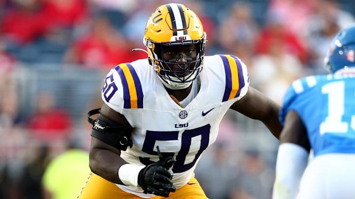 Sep 30, 2023; Oxford, Mississippi, USA; LSU Tigers offensive linemen Emery Jones Jr. (50) blocks during the first half against the Mississippi Rebels at Vaught-Hemingway Stadium. Mandatory Credit: Petre Thomas-Imagn Images