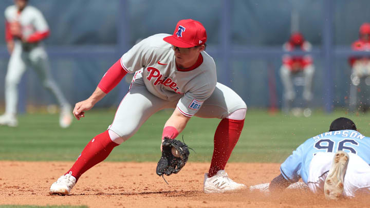 Feb 25, 2025; Port Charlotte, Florida, USA; Tampa Bay Rays outfielder Chandler Simpson (96) slides safely into second base against Philadelphia Phillies infielder Aidan Miller (81) at Charlotte Sports Park. Feb 25, 2025; Port Charlotte, Florida, USA; Tampa Bay Rays outfielder Chandler Simpson (96) slides safely into second base against Philadelphia Phillies infielder Aidan Miller (81) at Charlotte Sports Park.