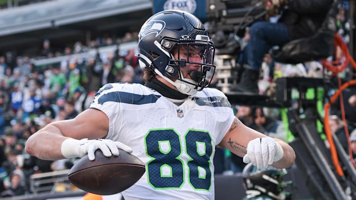 Dec 1, 2024; East Rutherford, New Jersey, USA; Seattle Seahawks tight end AJ Barner (88) celebrates after scoring a touchdown during the first half against the New York Jets at MetLife Stadium.