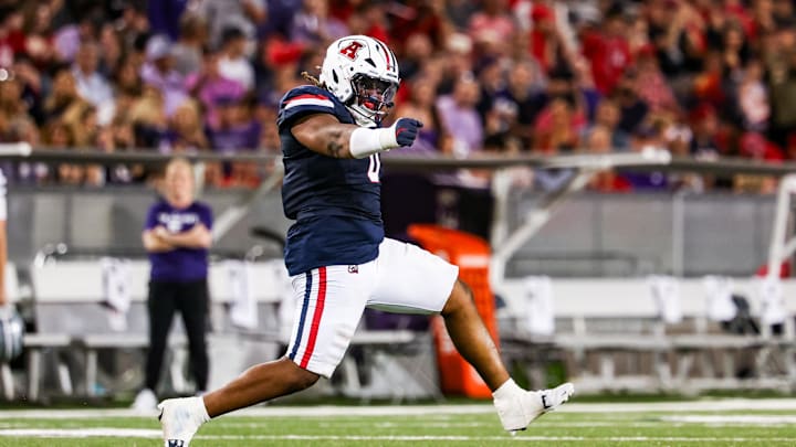 Sep 12, 2025; Tucson, Arizona, USA; Arizona Wildcats defensive lineman Deshawn McKnight (0) celebrates after he tackles the Kansas State Wildcats during the third quarter of the game at Arizona Stadium. Mandatory Credit: Aryanna Frank-Imagn Images