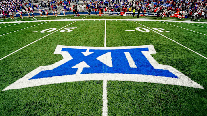 The Big 12 has suspended one of its officiating crews because of a missed rule violation.