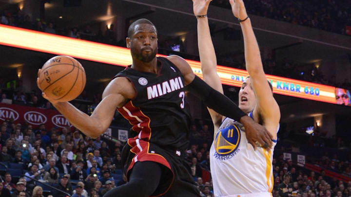 January 16, 2013; Oakland, CA, USA; Miami Heat shooting guard Dwyane Wade (3) passes the ball against Golden State Warriors shooting guard Klay Thompson (11) during the second quarter at Oracle Arena. Mandatory Credit: Kyle Terada-Imagn Images