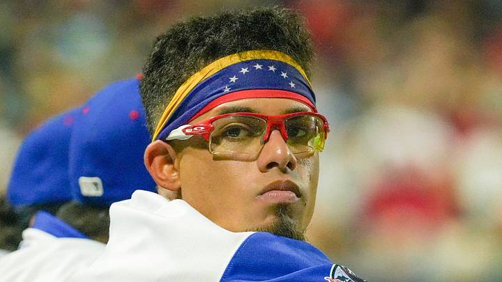 Franklin Arias watches WooSox teammates.
