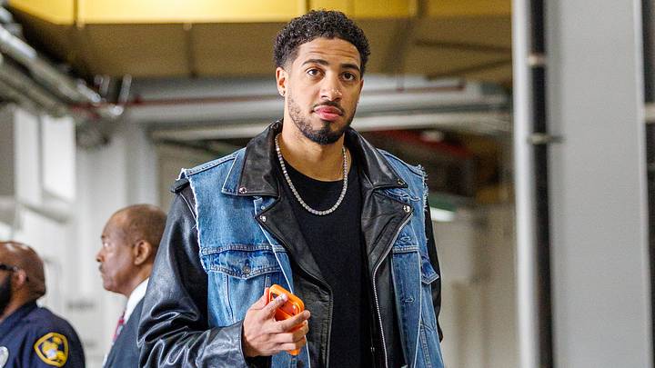 Tyrese Haliburton wearing Triple H's jacket