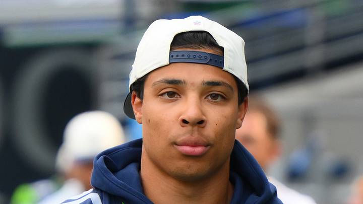 Seattle Seahawks running back Zach Charbonnet walks onto the field