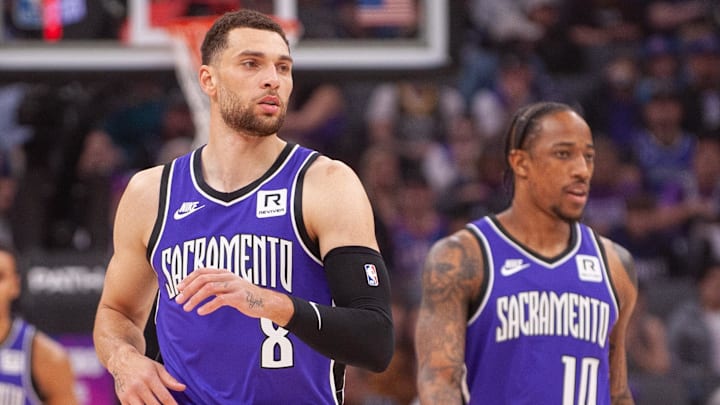 Feb 24, 2025; Sacramento, California, USA; Sacramento Kings guard Zach LaVine (8) and forward DeMar DeRozan (10) and forward Keegan Murray (13) walk up the court during the first quarter against the Charlotte Hornets at Golden 1 Center. Mandatory Credit: Ed Szczepanski-Imagn Images