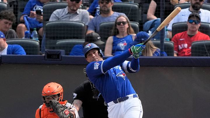 Sep 13, 2026; Toronto, Ontario, CAN;  Toronto Blue Jays designated hitter George Springer (4) hits a solo home run against the Baltimore Orioles during the fifth inning at Rogers Centre.  Mandatory Credit: John E. Sokolowski-Imagn Images