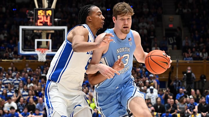 Mar 7, 2026; Durham, North Carolina, USA; North Carolina Tar Heels center Henri Veesaar (13) drives to the basket as Duke Blue Devils forward Maliq Brown (6) defends during the first half at Cameron Indoor Stadium. Mandatory Credit: Rob Kinnan-Imagn Images