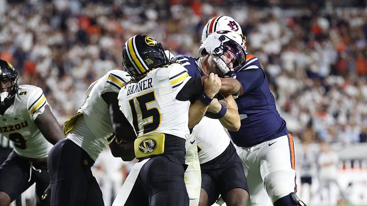 Oct 18, 2025; Auburn, Alabama, USA; Missouri Tigers safety Santana Banner (15) tackles Auburn Tigers quarterback Jackson Arnold (11) during the third quarter at Jordan-Hare Stadium. Mandatory Credit: John Reed-Imagn Images Oct 18, 2025; Auburn, Alabama, USA; Missouri Tigers safety Santana Banner (15) tackles Auburn Tigers quarterback Jackson Arnold (11) during the third quarter at Jordan-Hare Stadium. Mandatory Credit: John Reed-Imagn Images