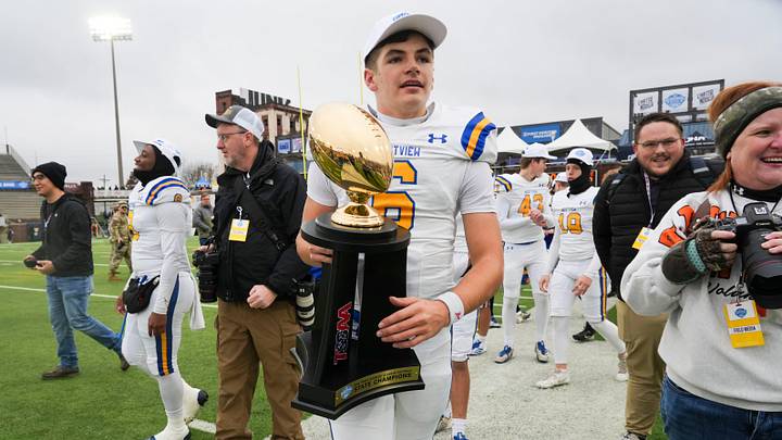 Westview's Graham Simpson (6) with the Class 3A Championship trophy in Finley Stadium, Chattanooga, Tenn., on Friday, Dec. 5, 2025. Westview's Graham Simpson (6) with the Class 3A Championship trophy in Finley Stadium, Chattanooga, Tenn., on Friday, Dec. 5, 2025.