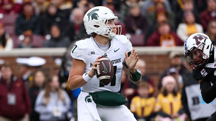 Nov 1, 2025; Minneapolis, Minnesota, USA; Michigan State Spartans quarterback Alessio Milivojevic (11) looks to pass against the Minnesota Golden Gophers during the first half at Huntington Bank Stadium. Mandatory Credit: Matt Krohn-Imagn Images